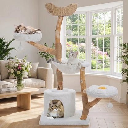 arbre a chat de couleur blanc dans un beau salon lumineux et très chic avec trois chat bien installés dans l'arbre pour la sieste