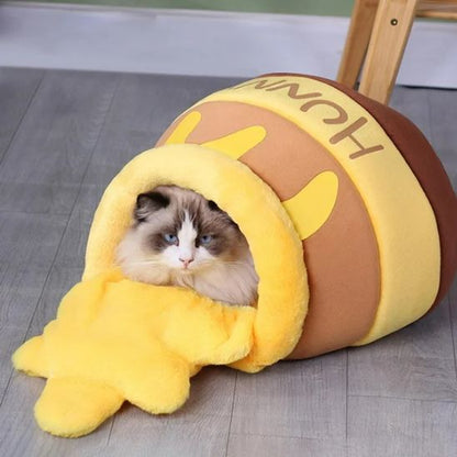 lit pour chat brun et jaune