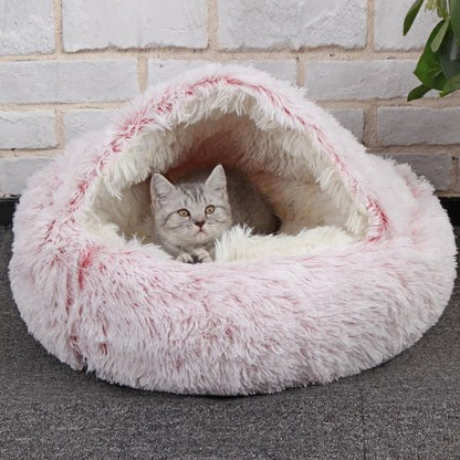 panier pour chat de couleur rose semi fermé avec une forme ronde et un rembourrage très épais